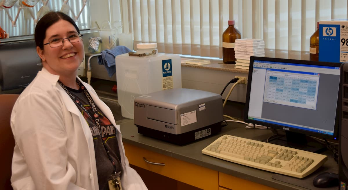 Lab tech sitting at computer